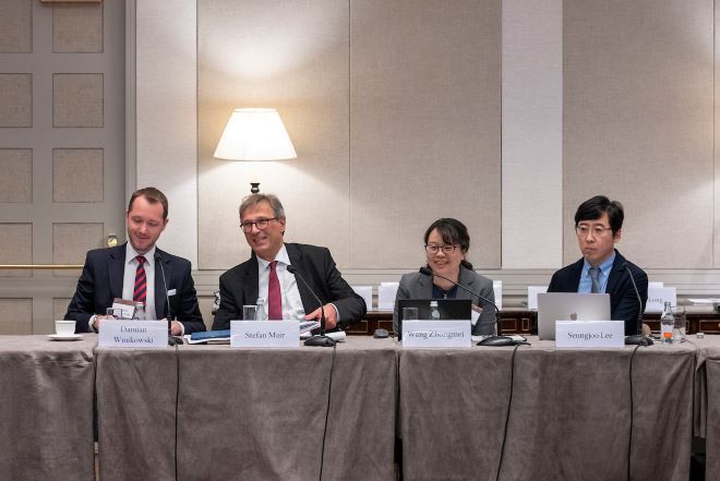 Damian Wnukowski, Stefan Mair, Wang Zhongmei, and Seungjoo Lee during the session "Revitalizing the World Trade Organization" (Howard Heyman).